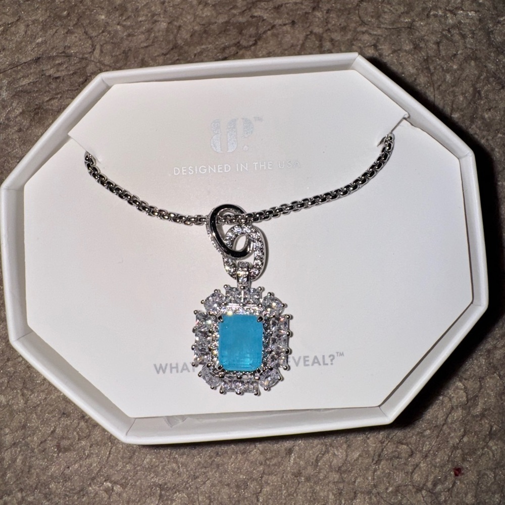 Radiant Silver Necklace with Blue Gemstone
